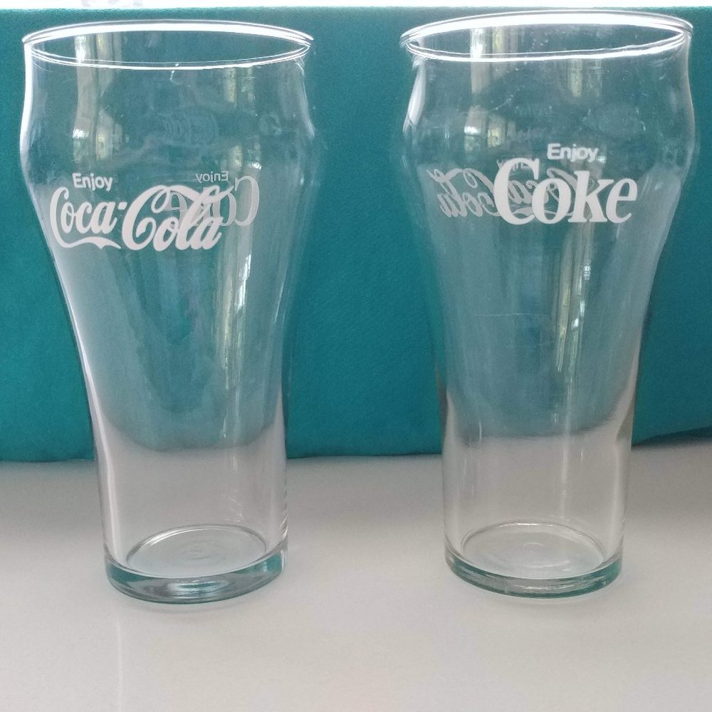 Here is a nice Vintage set of 2 Enjoy Coca- Cola glasses.